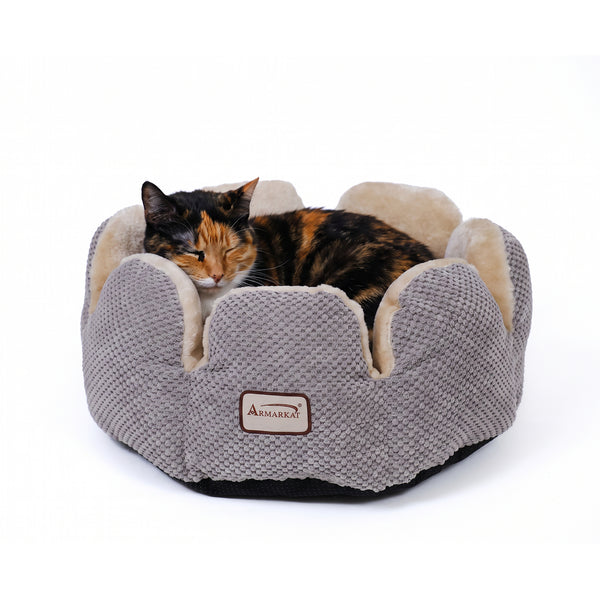 Armarkat flower-shaped bed with a cat resting inside